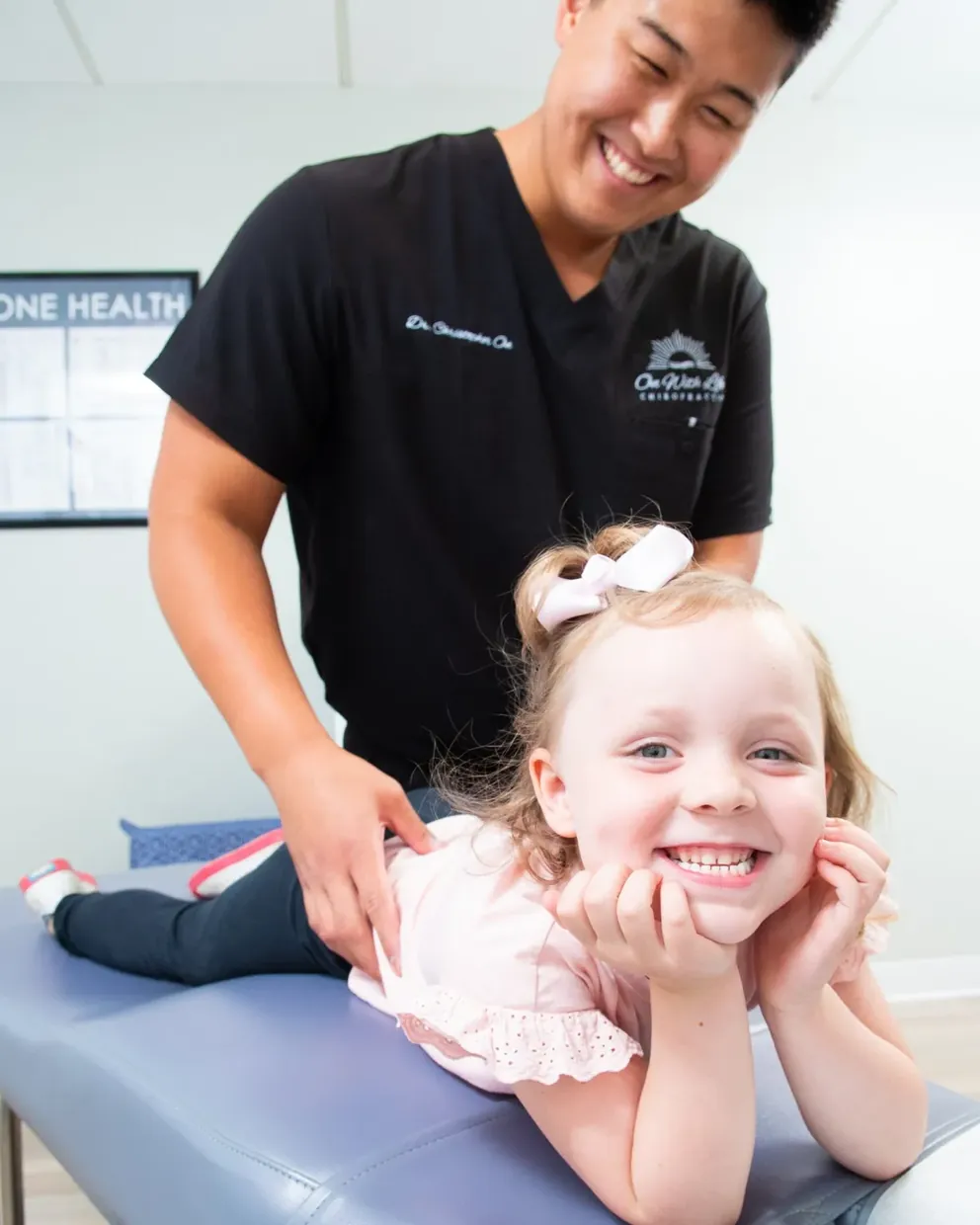 Gentle pediatric chiropractic adjustment for a child in Lenexa
