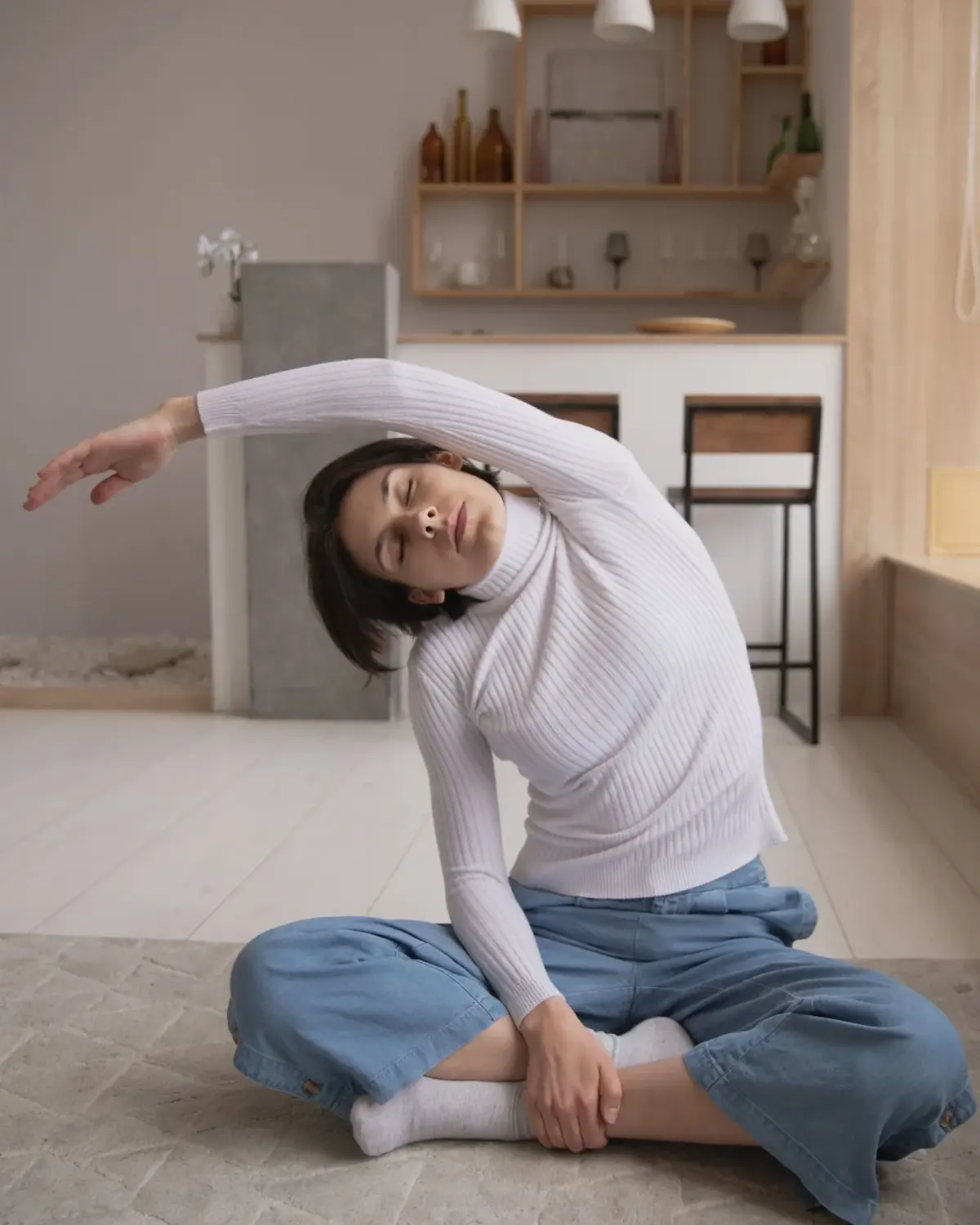 Chiropractor adjusting patient spine for back pain relief in Lenexa, KS